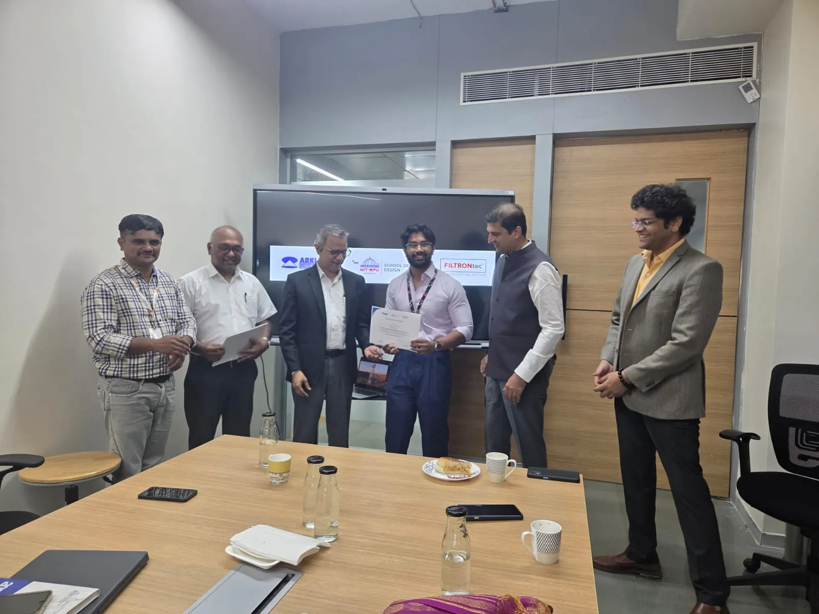 Pranshu receiving his certificate of excellence from the Arklite and MIT-WPU panel